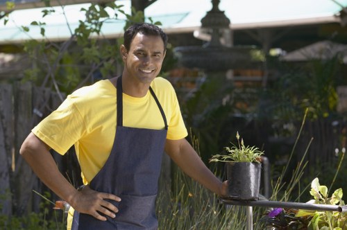 Professional landscapers working in Earls Court gardens